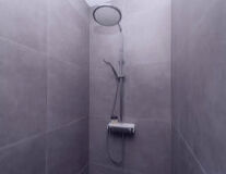 wall, sink, plumbing fixture, shower, indoor, tap, bathtub, toilet, bathroom accessory, art, black and white